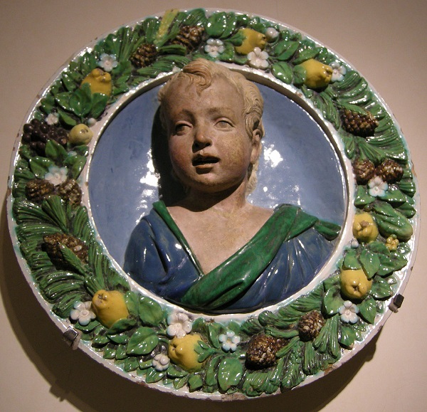 1060px-Luca_della_robbia_il_giovane,_effige_ideale_di_fanciullo,_detto_san_giovannino,_1500-1510.JPG