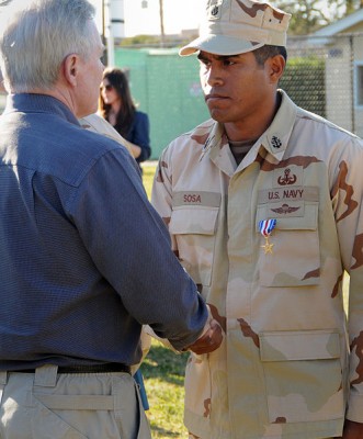 496px-US_Navy_110211-N-DO222-020_Secretary_of_the_Navy_(SECNAV)_the_Honorable_Ray_Mabus_congratulates_Chief_Explosive_Ordinance_Disposal_technician_Gerar.jpg