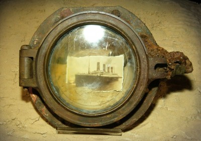 213348-a-photograph-of-the-titanic-is-seen-through-a-porthole.jpg